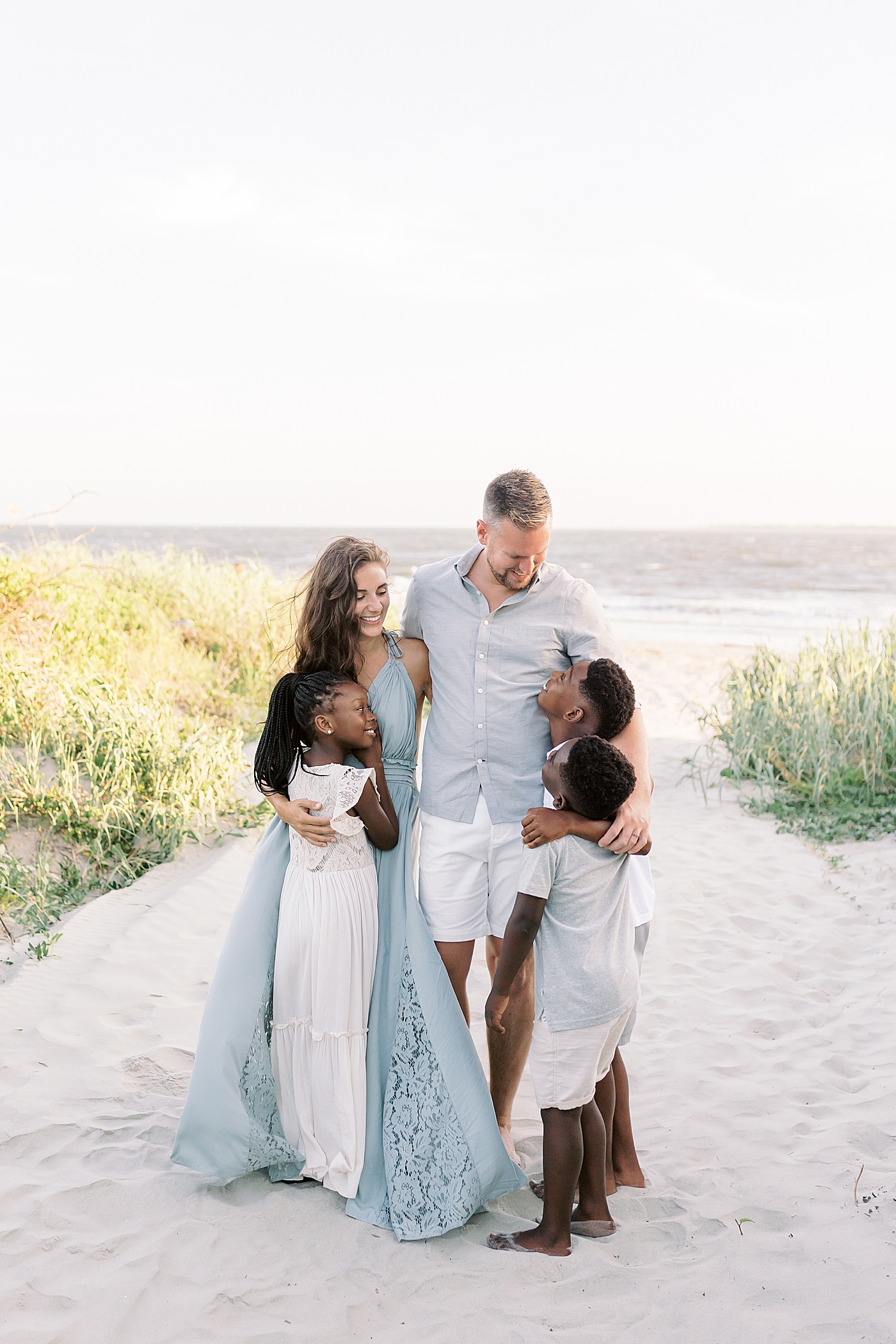 Family of five on the beach | Image by Caitlyn Motycka