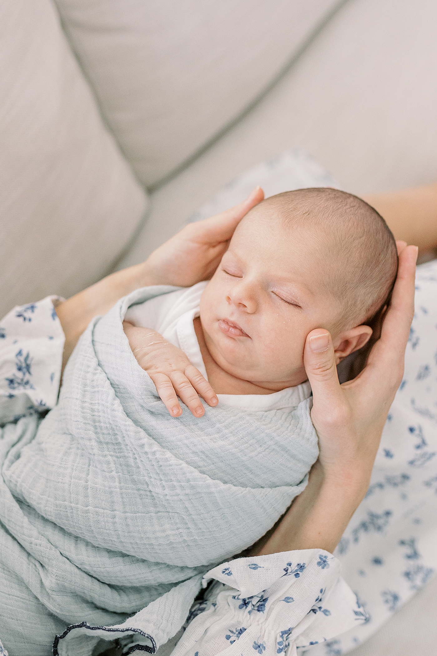 Detail of sleeping newborn during lifestyle newborn photos | Image by Caitlyn Motycka