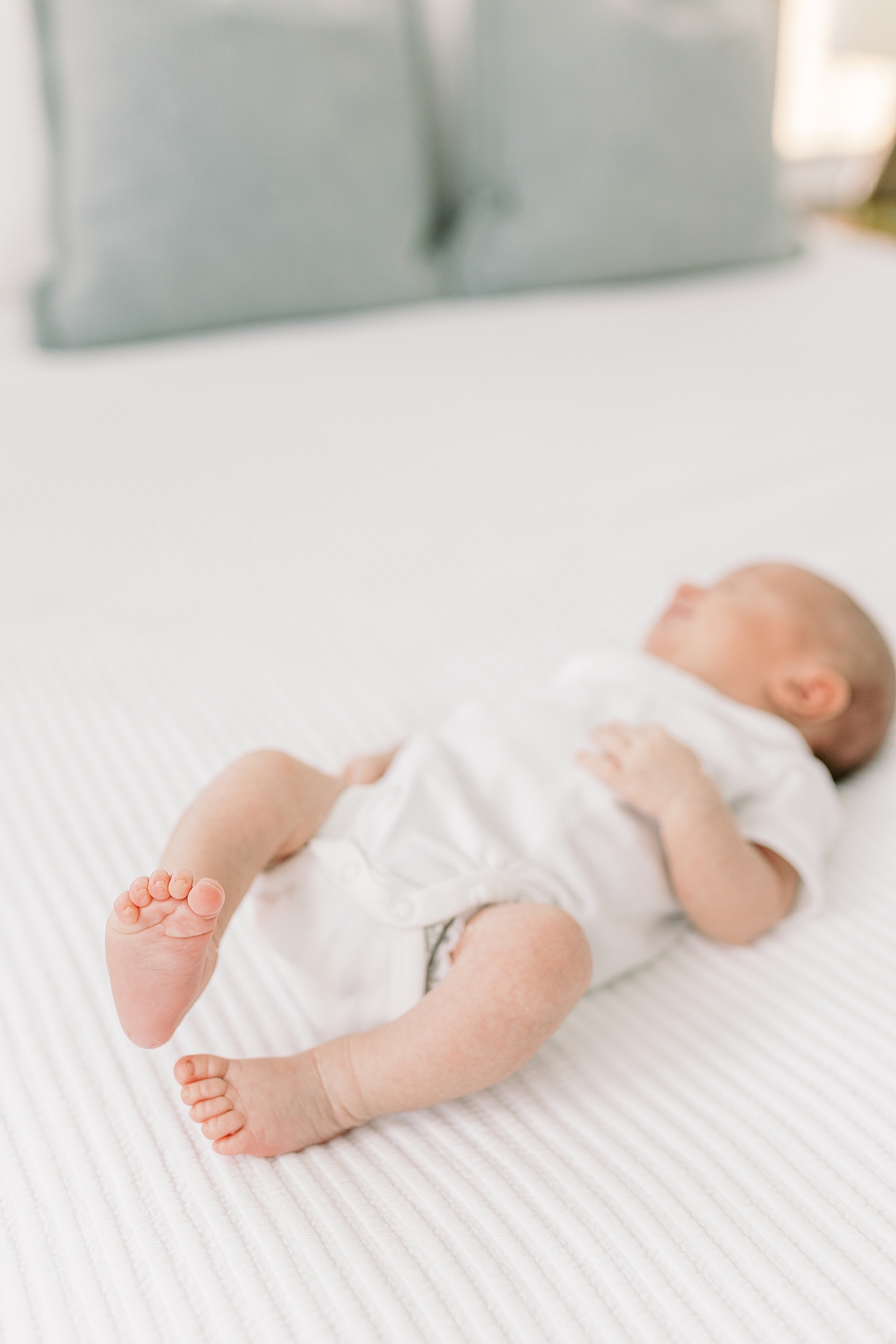 Detail of baby's foot during lifestyle newborn photos | Image by Caitlyn Motycka