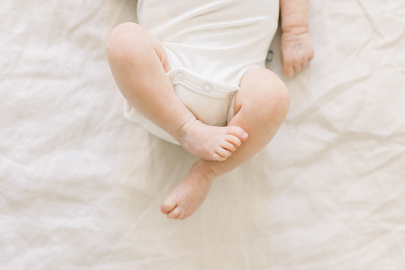 Detail of newborn baby's feet | Image by Caitlyn Motycka