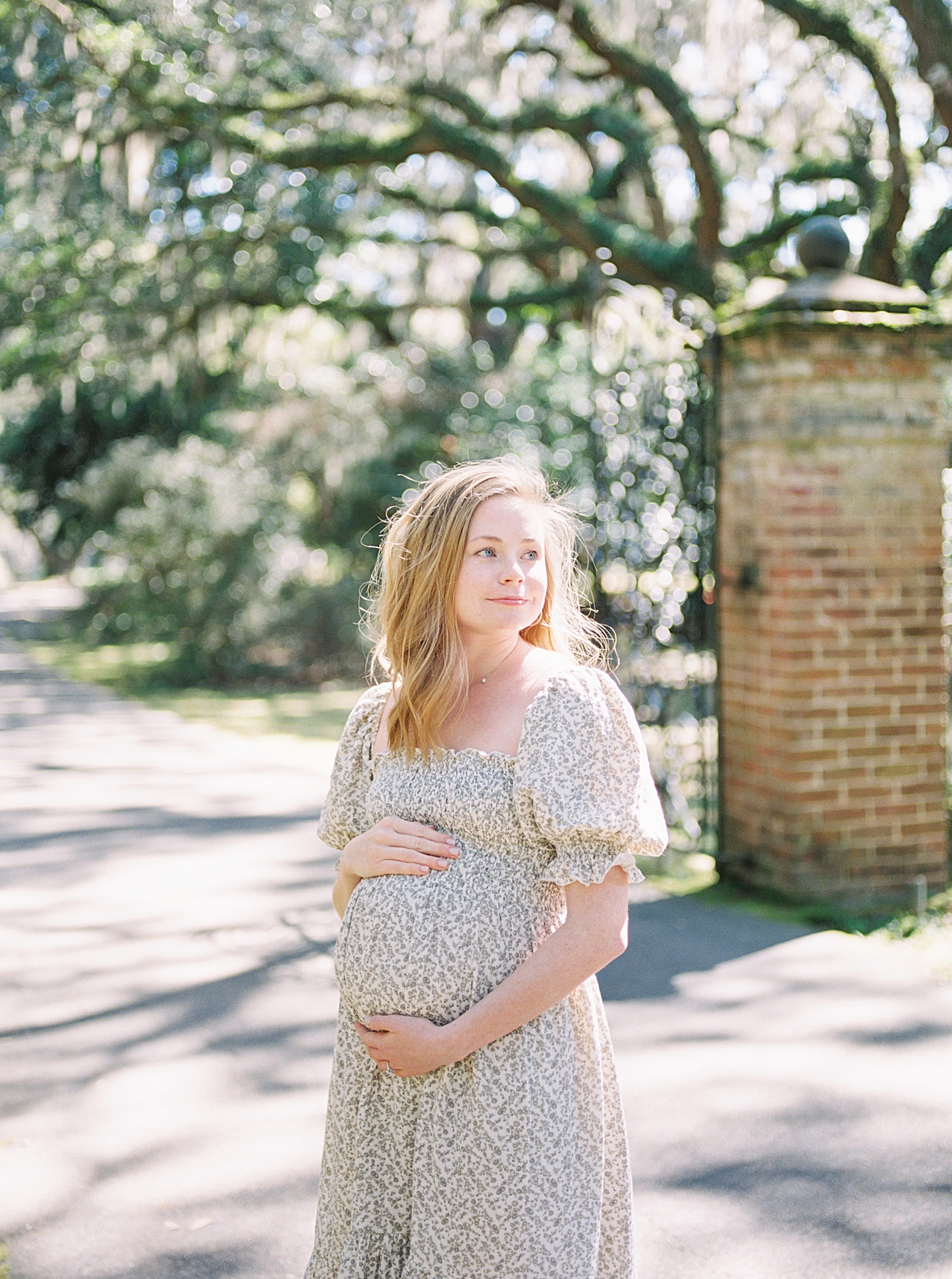 during her Maternity Session at Charlestowne Landing| Image by Caitlyn Motycka Photography