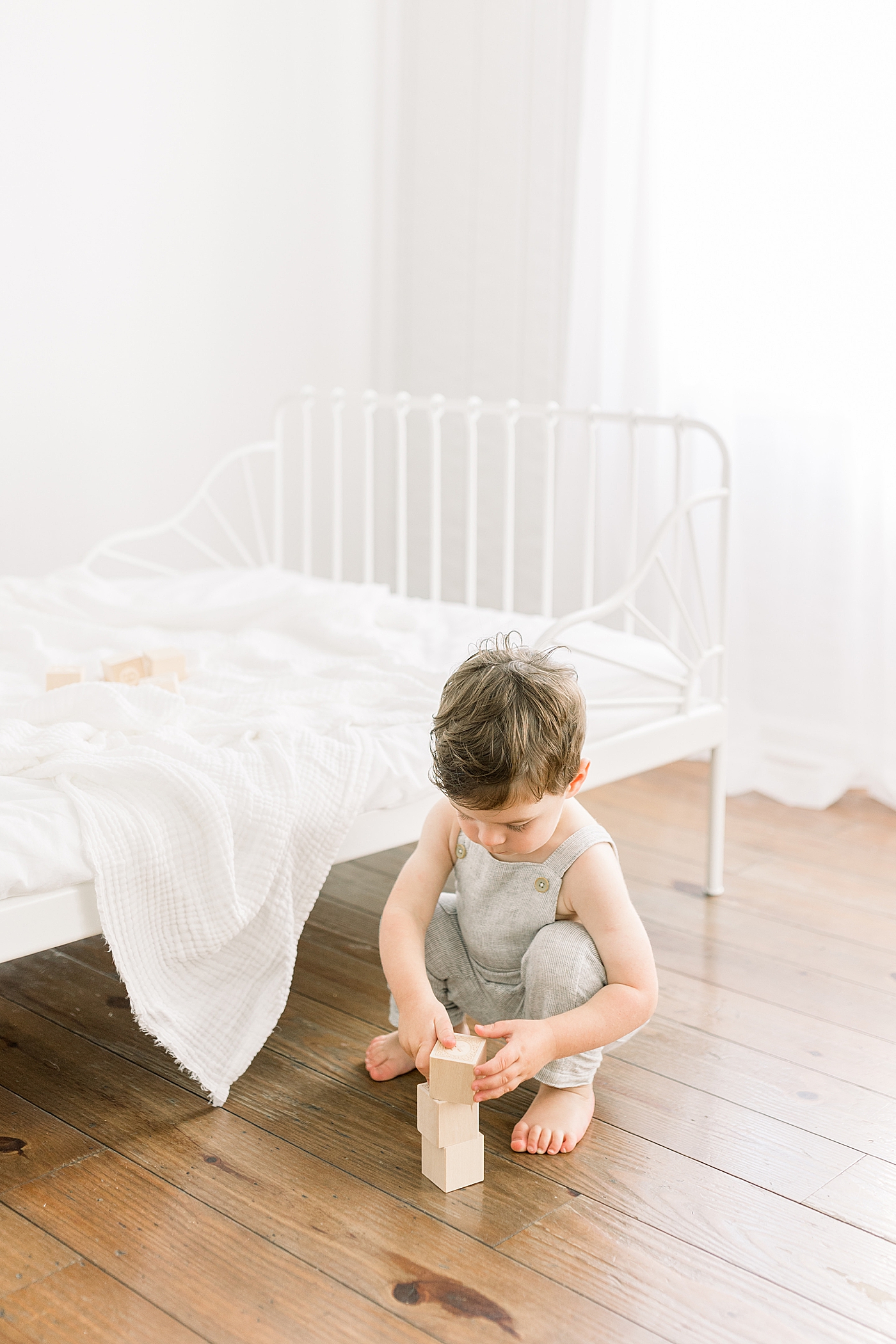 Little boy playing with wooden blocks | Image by Caitlyn Motycka